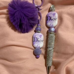 Purple matching keychain and rhinestone pen with extra pen refill.